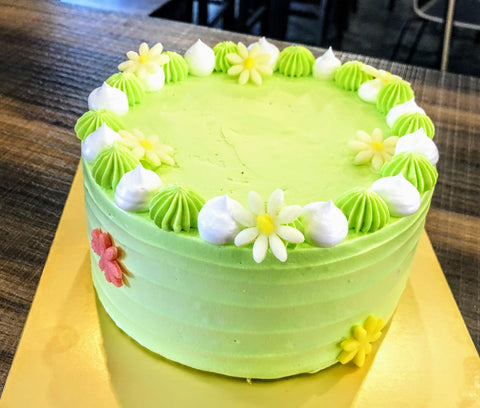 GREEN FLORA WITH WHITE ON GREEN CREAM WHOLE CAKE